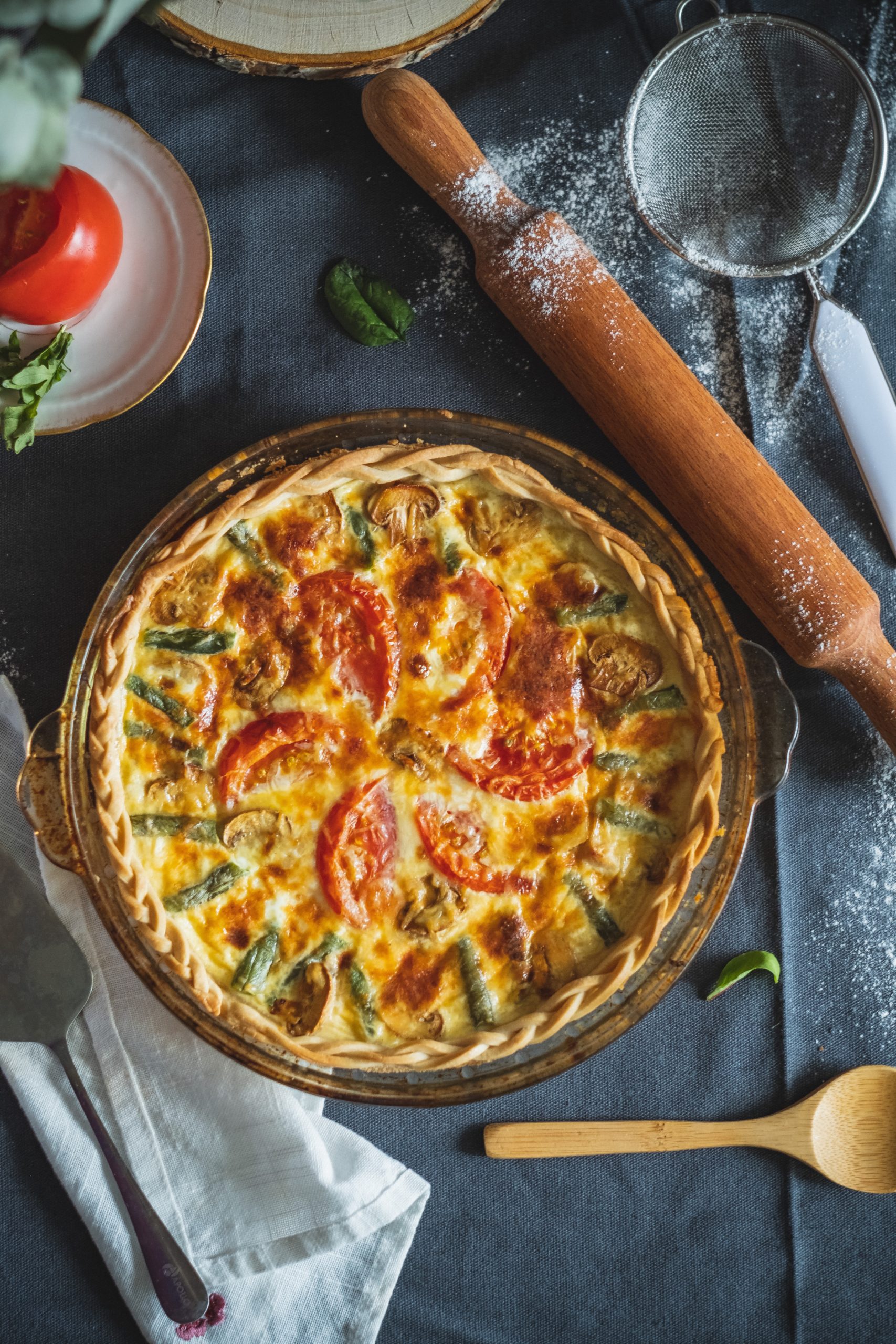 baked vegetable quiche with asparagus and tomatoes